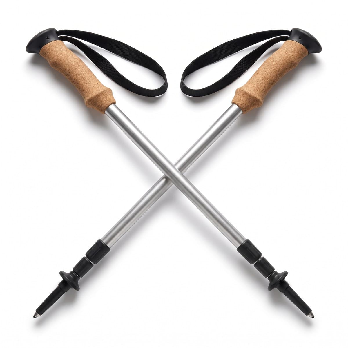 A pair of aluminum trekking poles with cork grips and black wrist straps, crossed